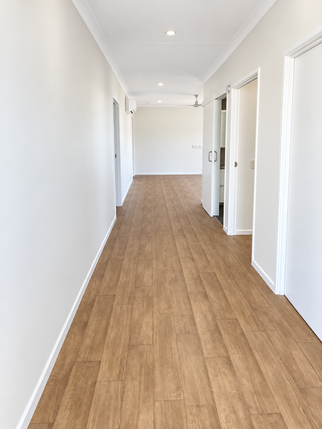 Bright Minimalist Hallway Perspective.png