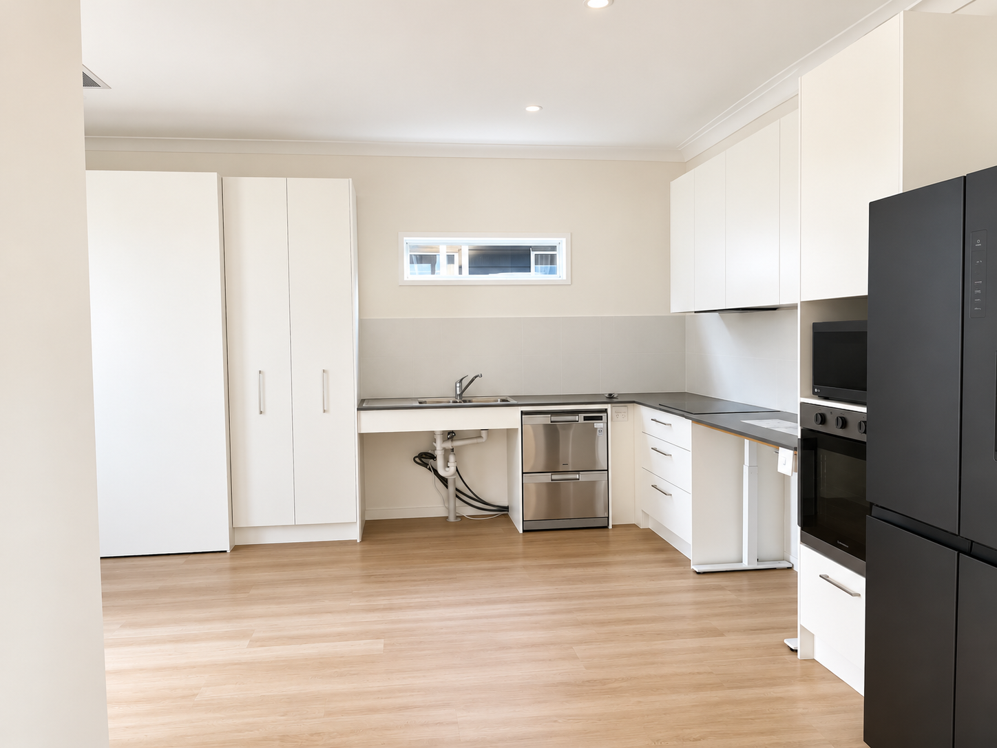 Bright Minimalist White Kitchen Interior.png