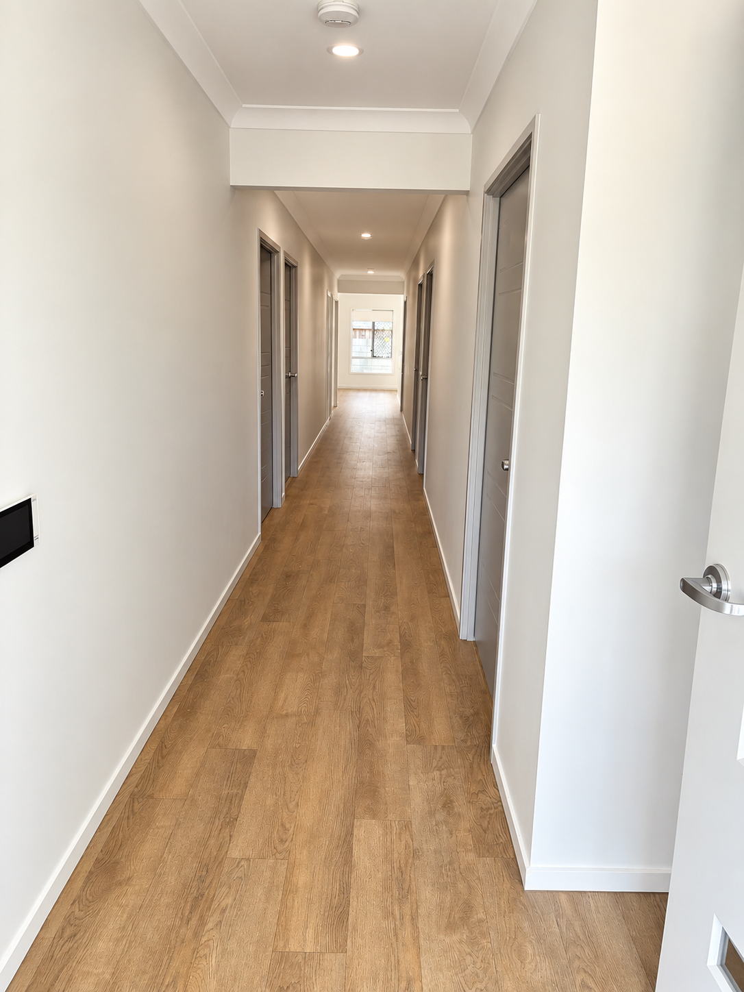 Bright Modern Hallway Perspective.png