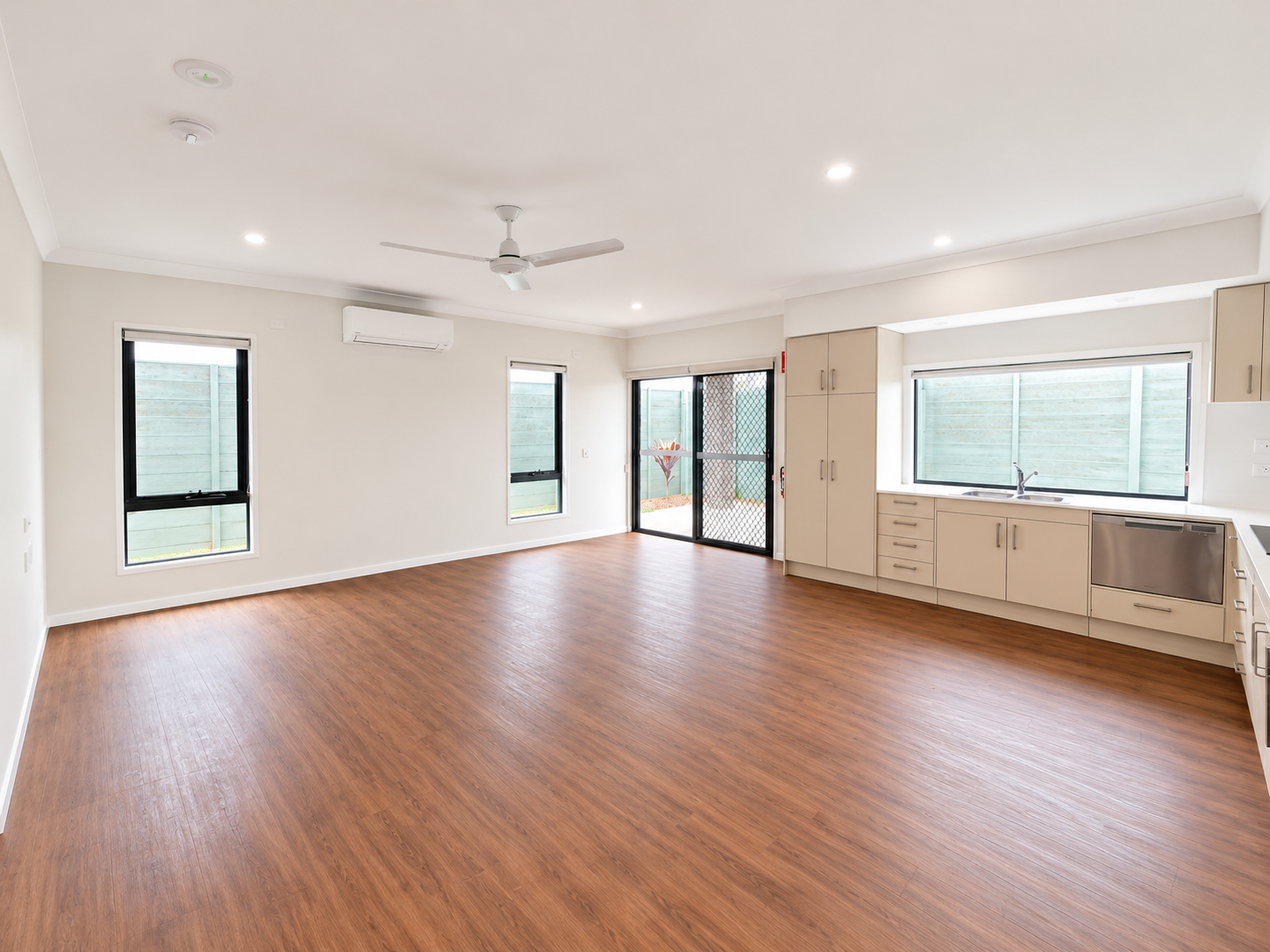 Spacious Minimalist Open-Plan Kitchen Living Area.png