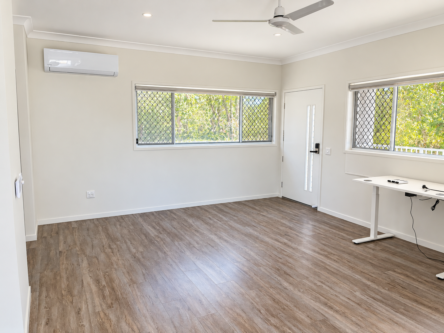 Bright Minimalist Room with Garden Views.png