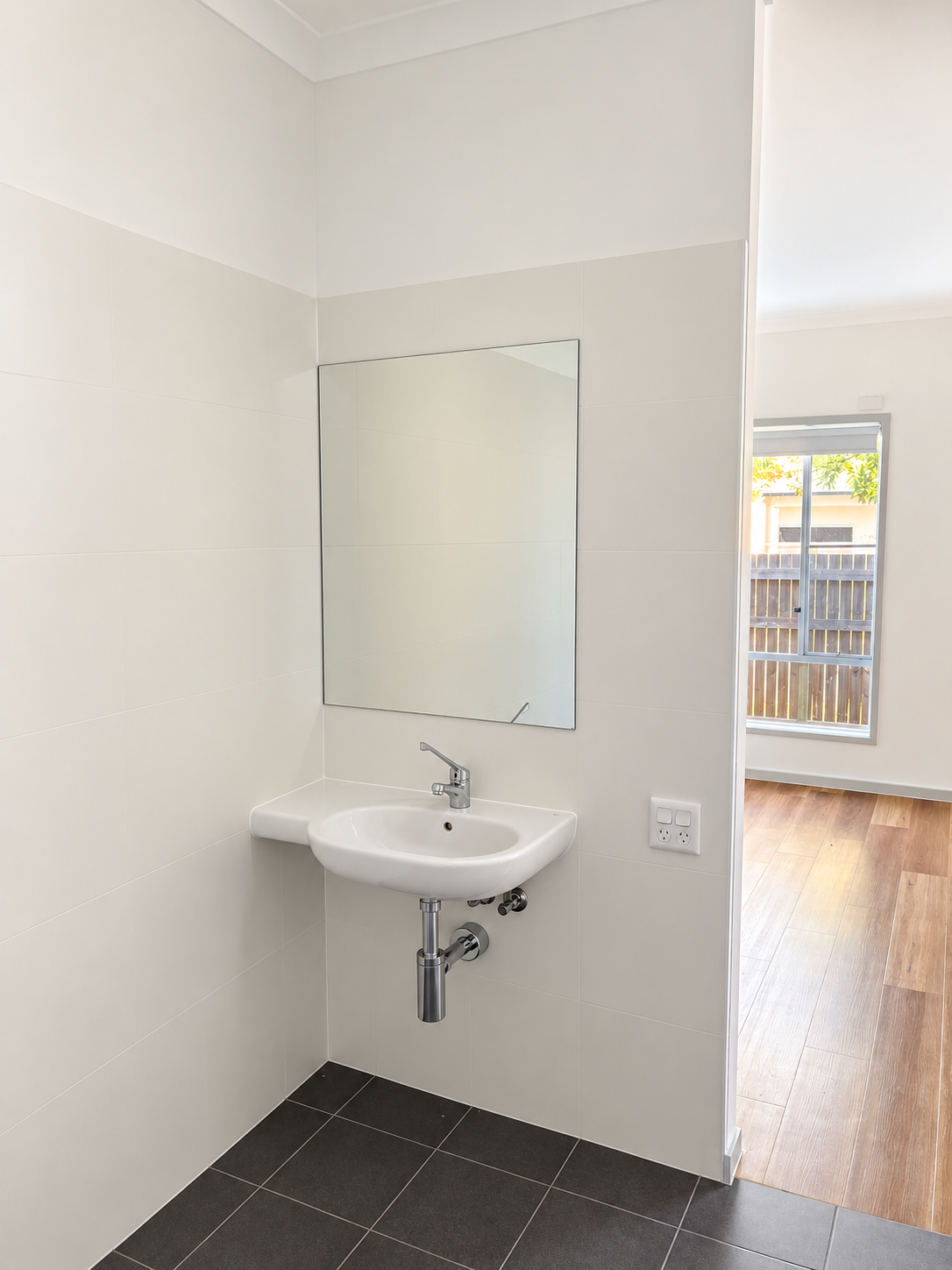 Minimalist Bathroom Nook with Sunlit Doorway.png