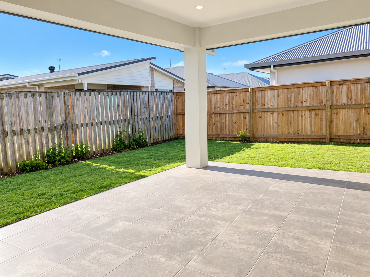 Modern Covered Patio and Sunny Backyard.png