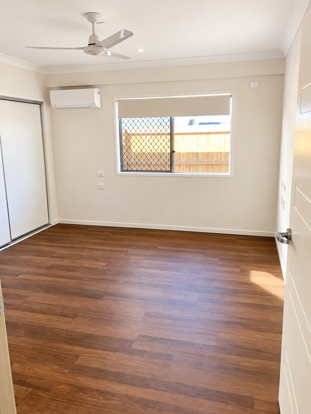 Empty Modern Room with Warm Wood Flooring.png