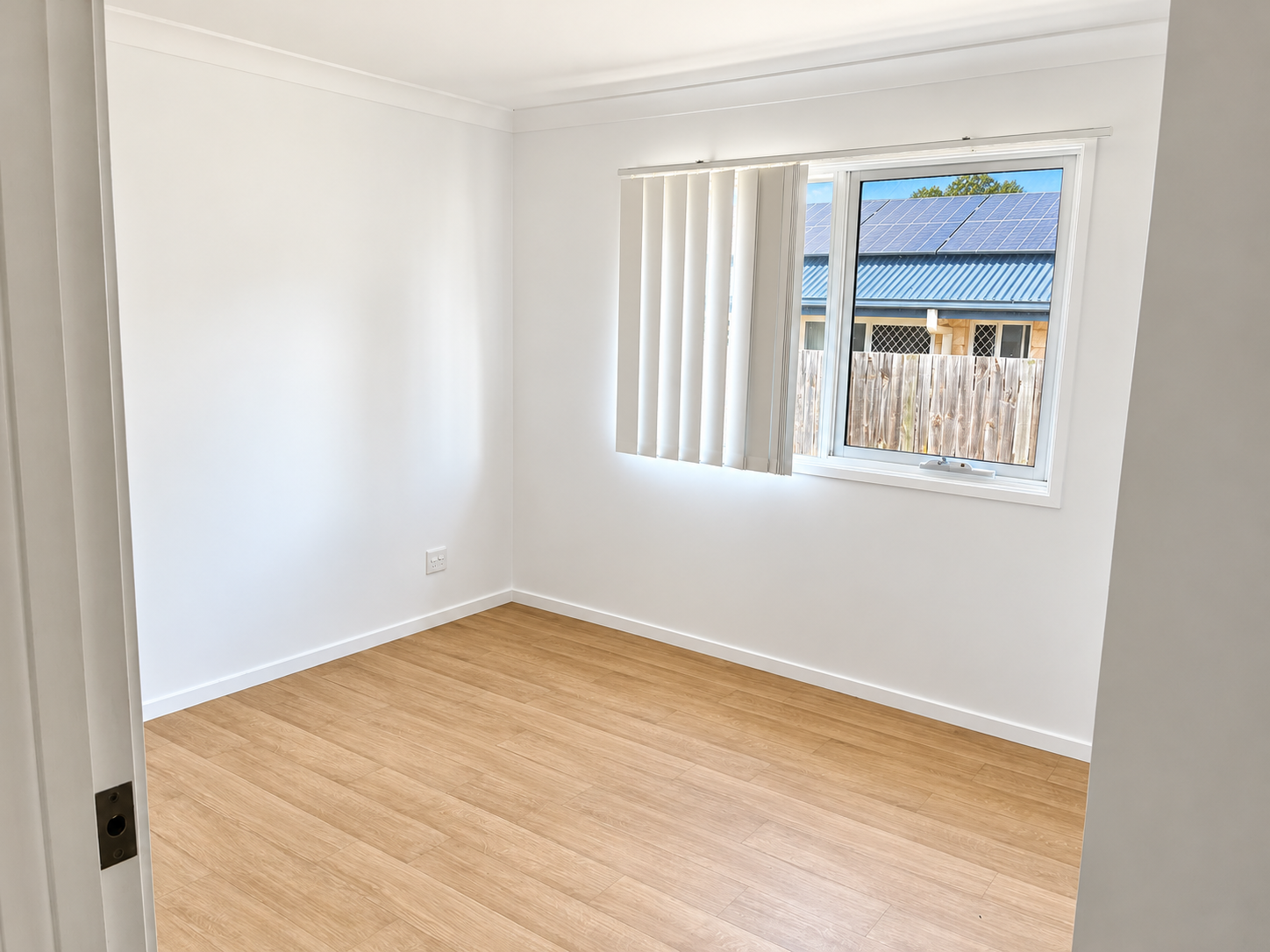 Bright Minimal Room with Solar Panel View.png