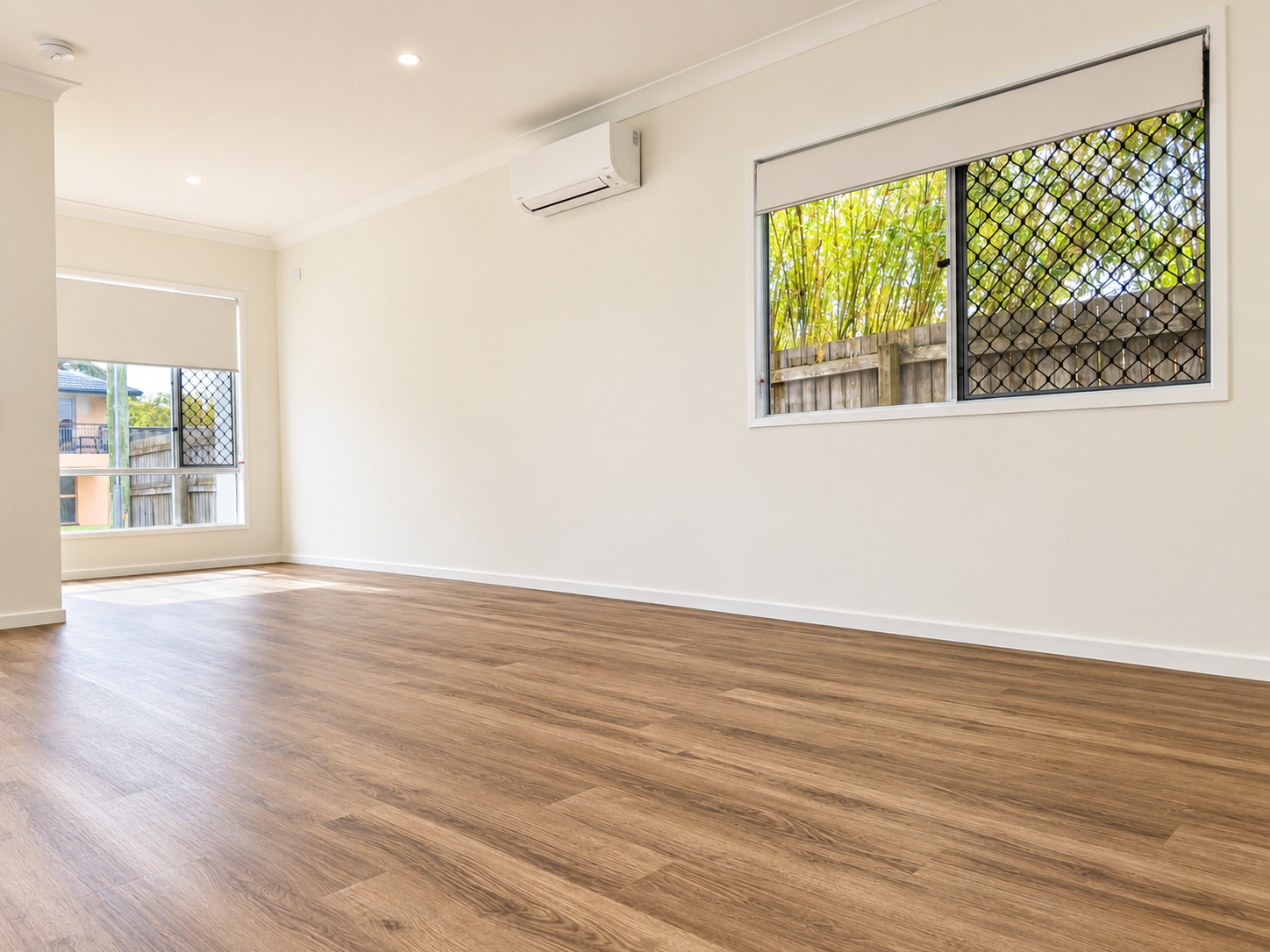 Bright Empty Modern Room with Oak Flooring.png