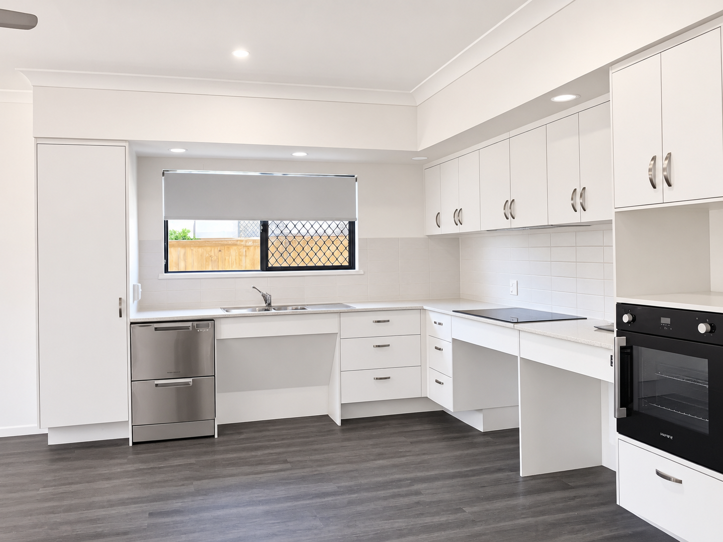 Bright Modern White Kitchen with Island Cooktop.png