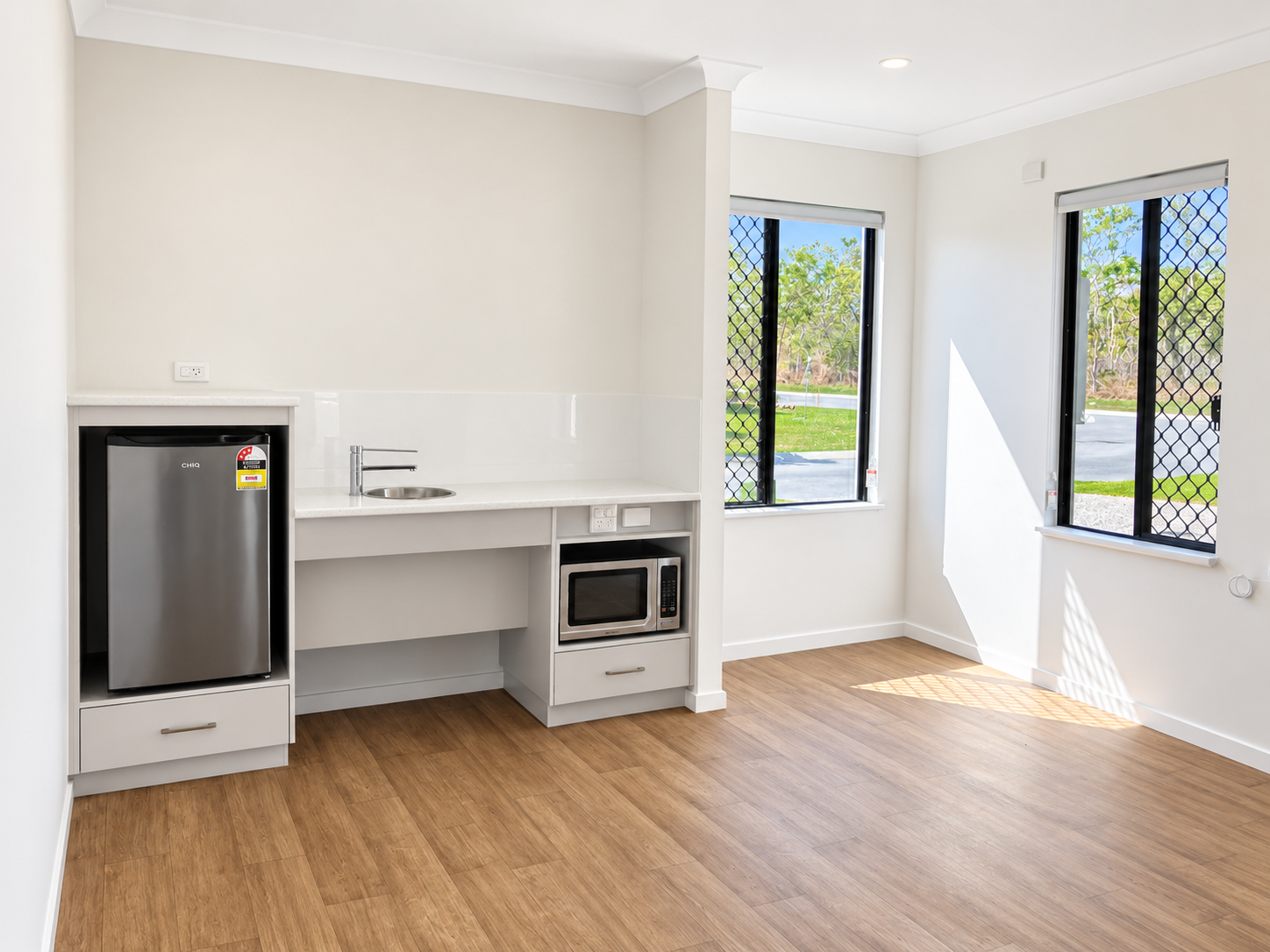 Bright Modern Kitchenette with Sunlit Windows.png