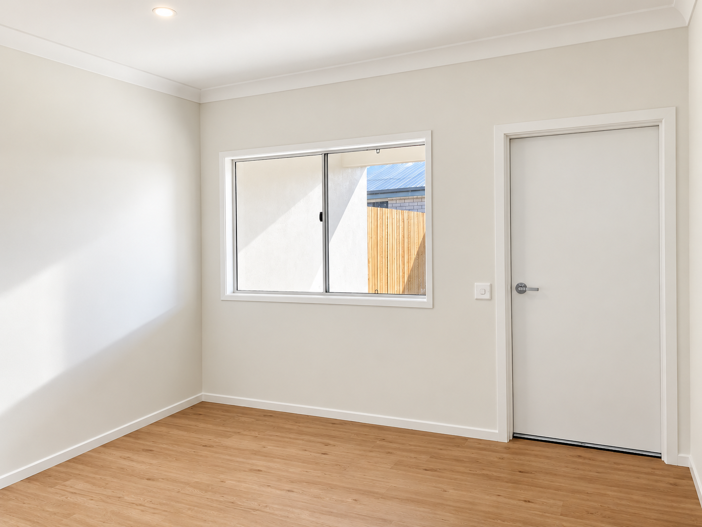 Bright Minimal Room with Window and Door.png
