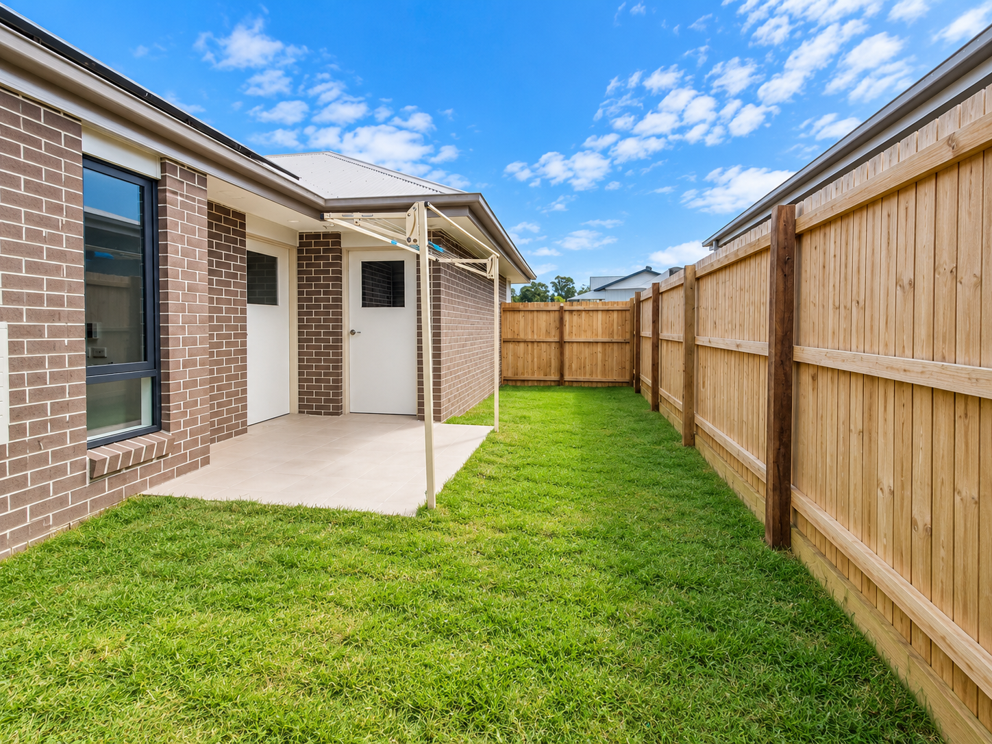 Modern Suburban Yard and Clothesline.png