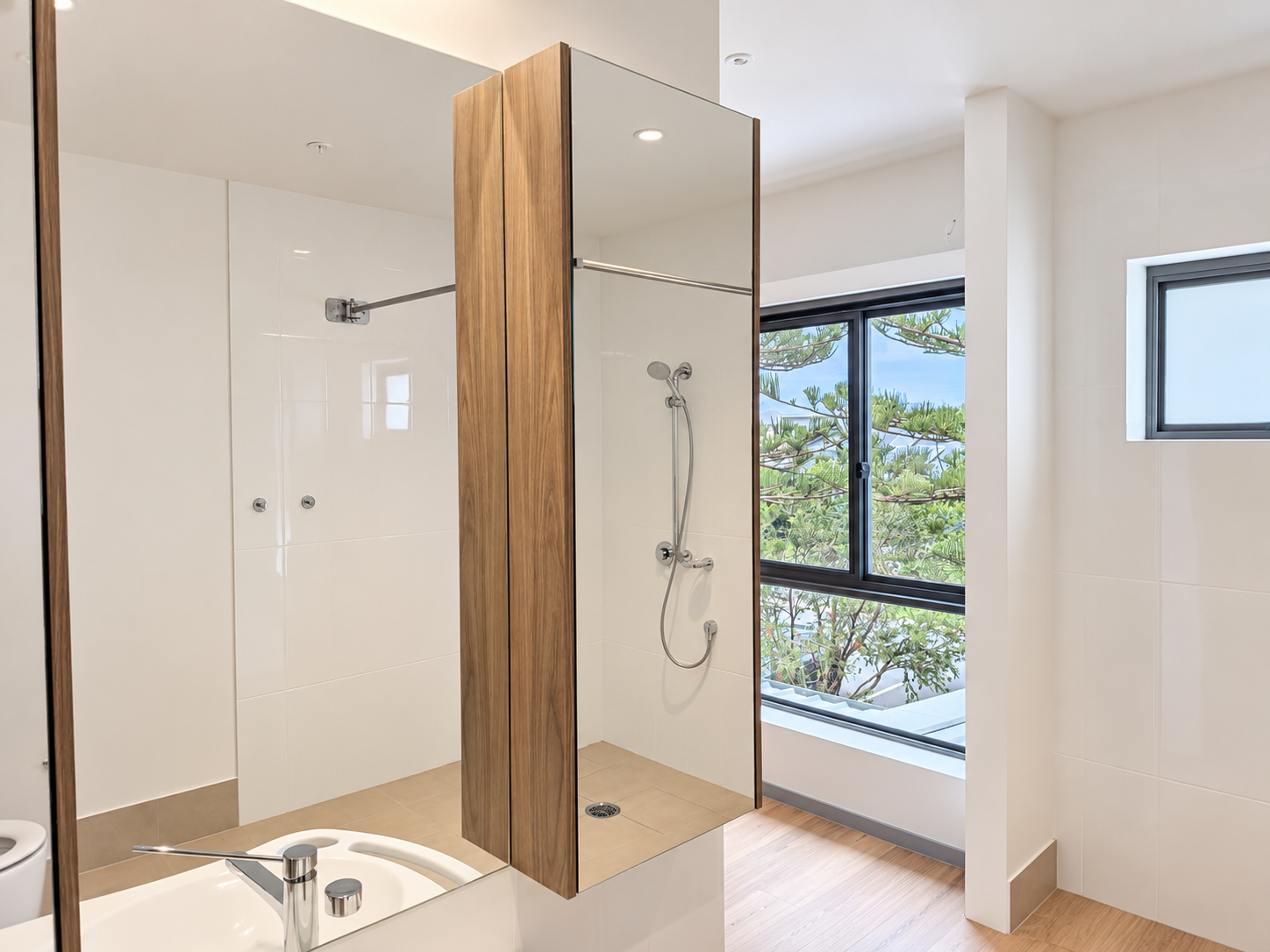 Bright Modern Bathroom with Wood and Chrome.png