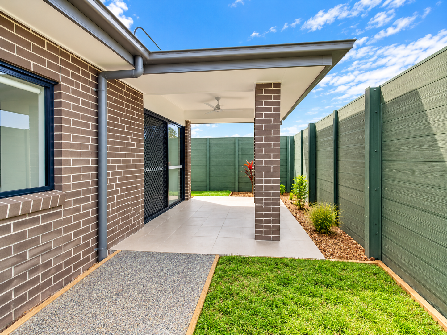Modern Backyard Patio with Garden Fencing.png