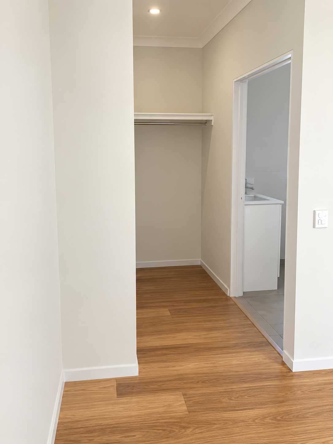 Minimal Hallway with Open Walk-In Closet.png