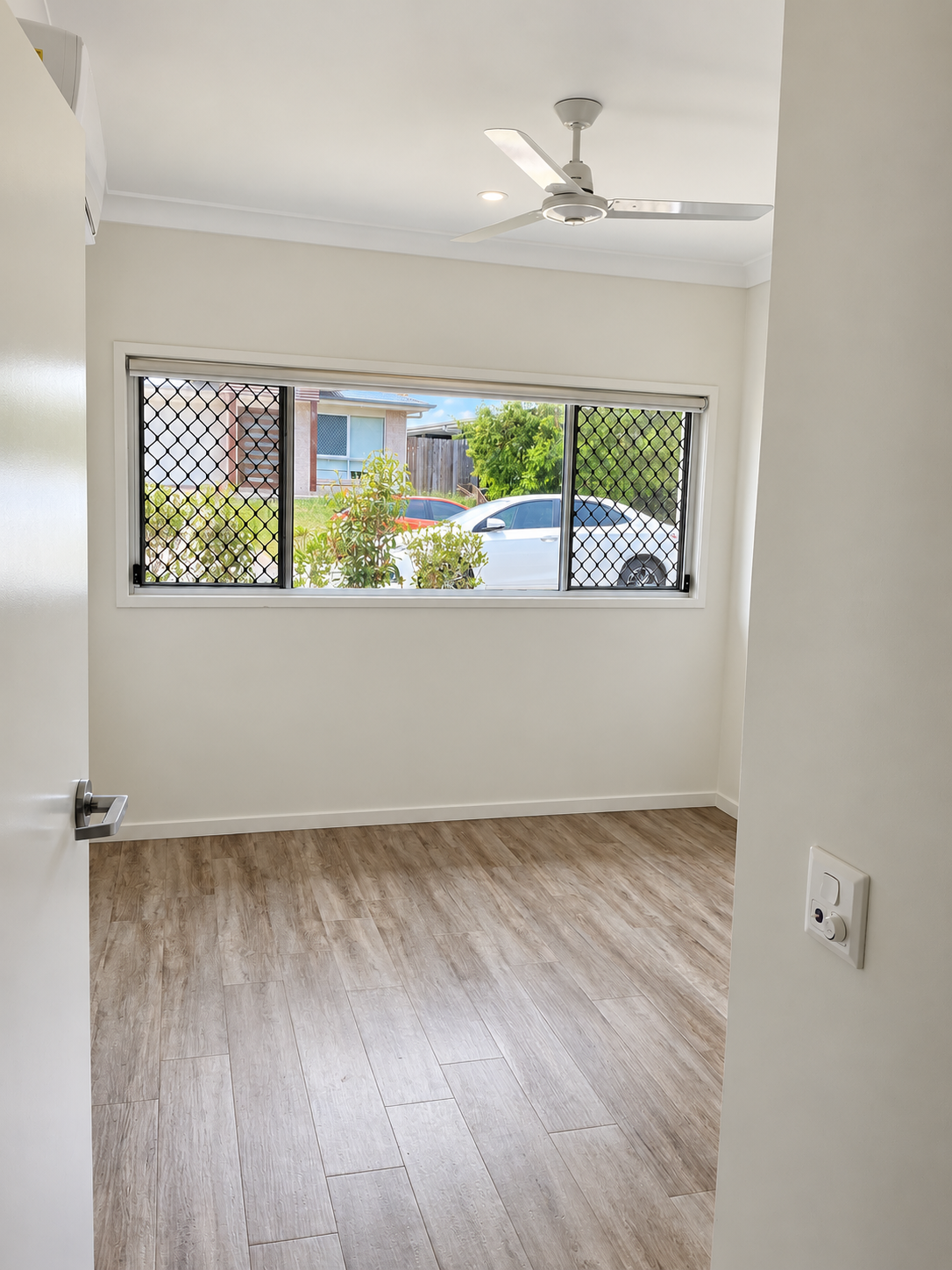 Bright Empty Room with Window View.png