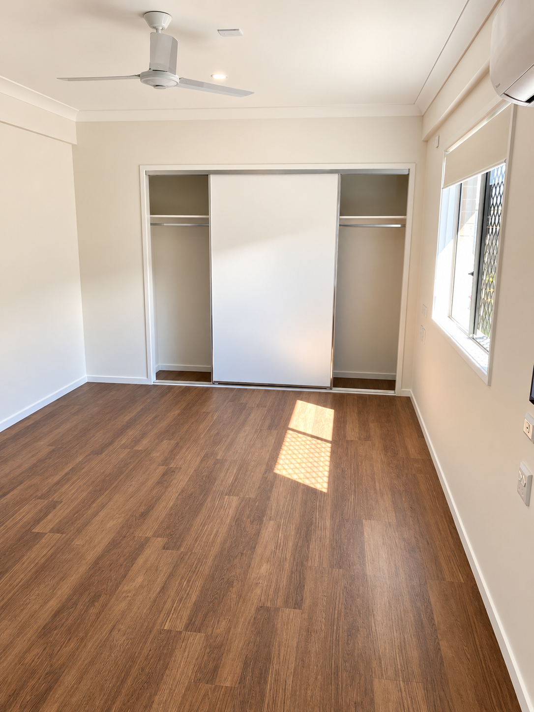 Sunlit Minimal Bedroom with Built-In Wardrobe.png
