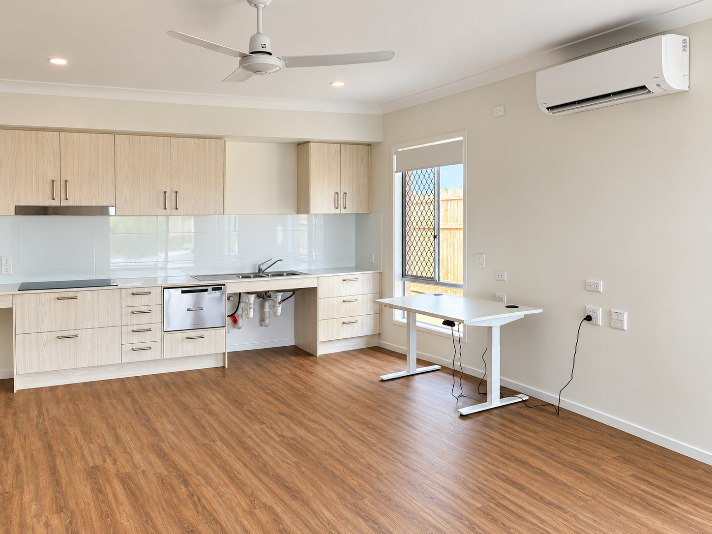 Bright Modern Kitchen with Desk and Window.png