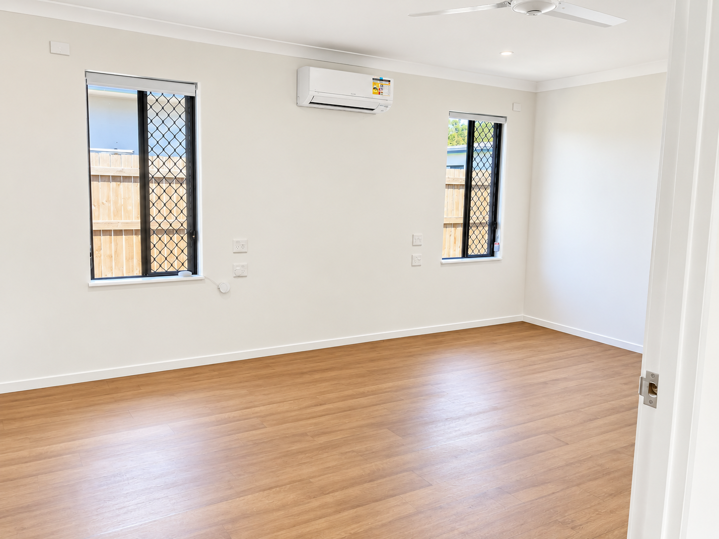 Bright Minimalist Room with Modern Windows.png