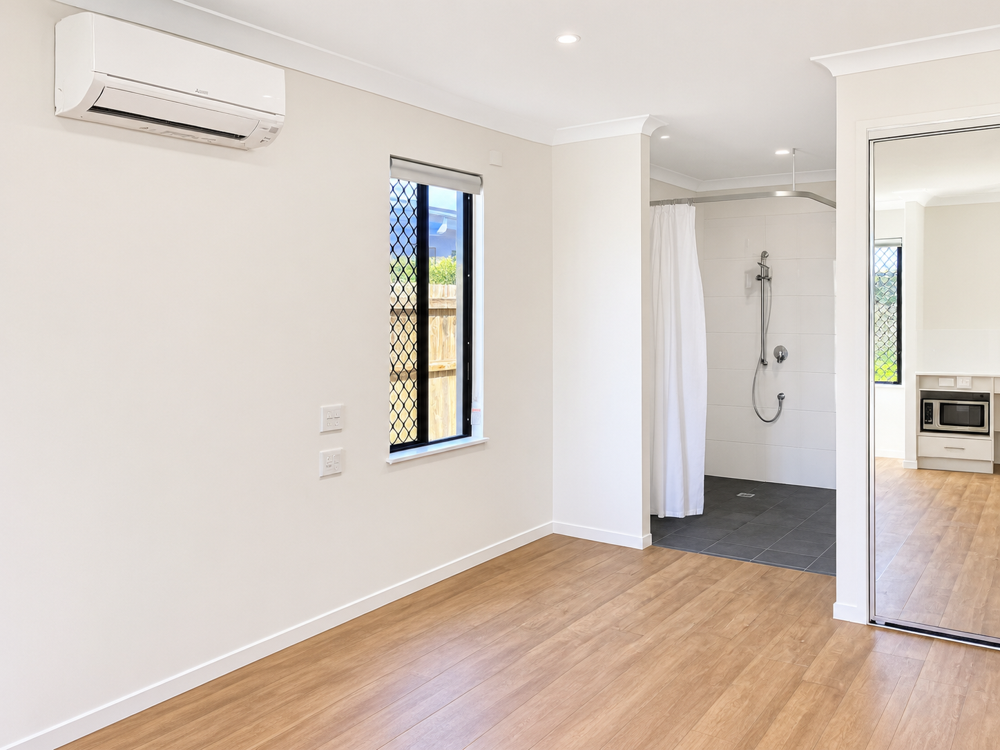 Modern Bright Ensuite and Kitchenette Interior.png