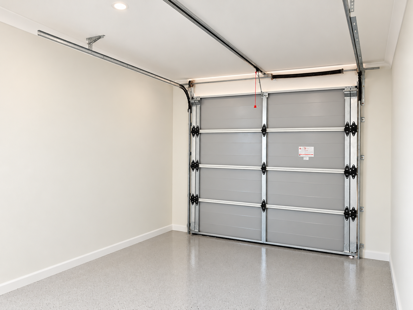 Bright Modern Garage Interior with Overhead Door.png