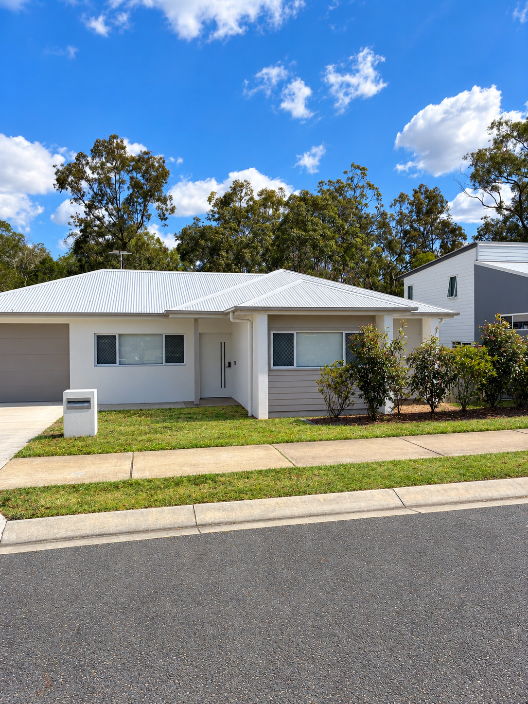 Bright Suburban Home Exterior with Mailbox 37.png