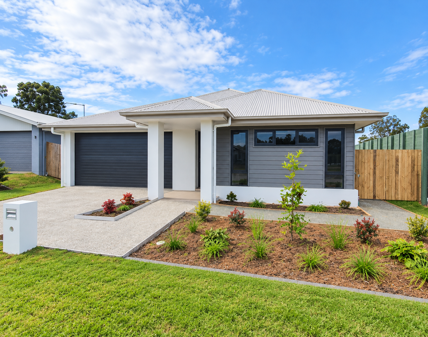 Modern Suburban Home with Landscaped Front Yard.png