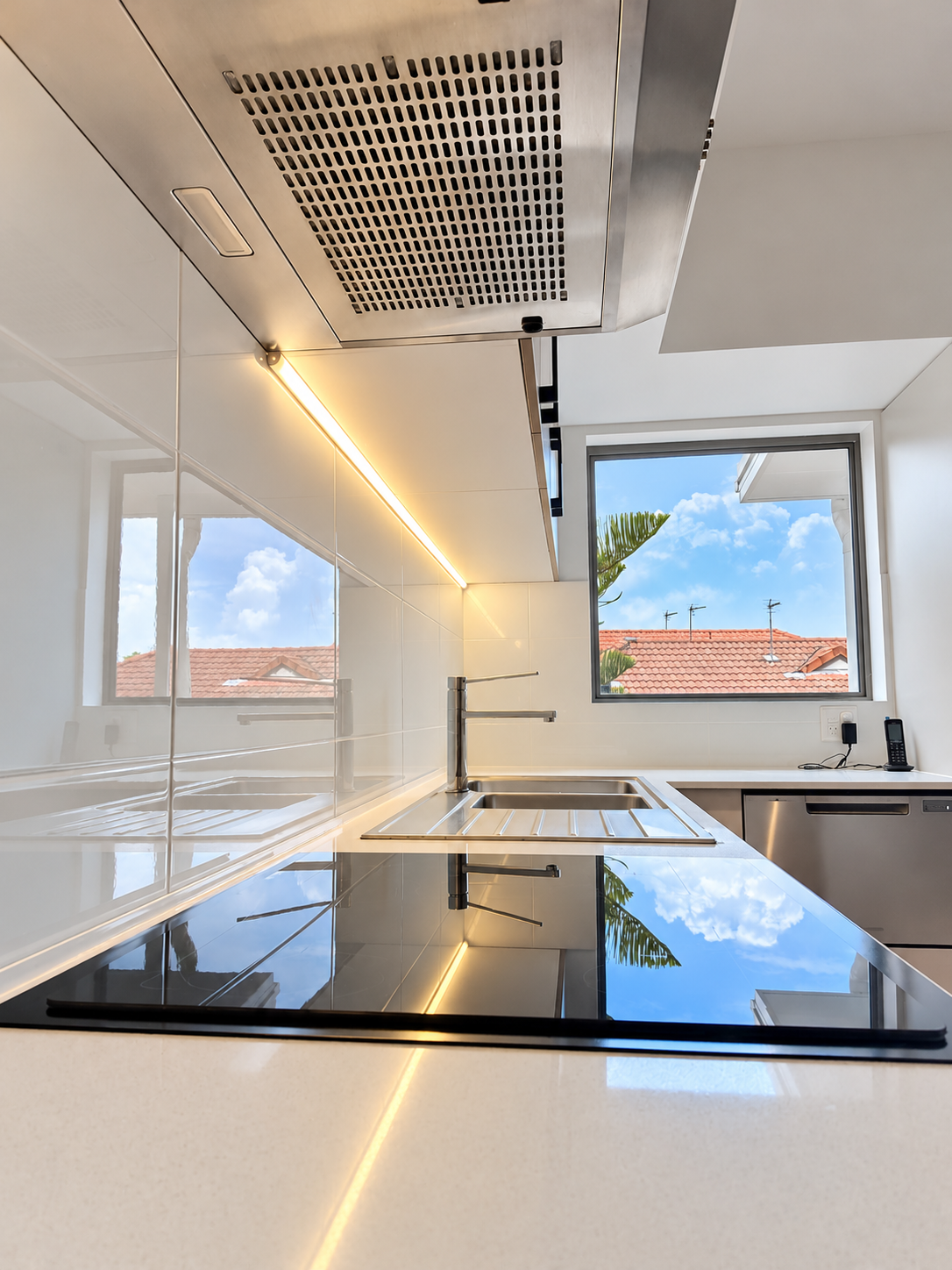 Bright Modern Kitchen with Reflections.png