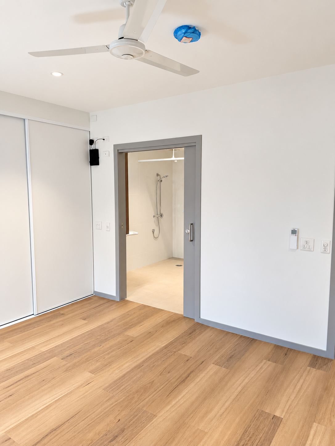 Bright Minimal Room with Accessible Bathroom.png