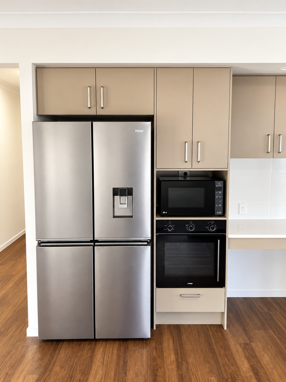 Modern Beige Kitchen with Stainless Appliances.png