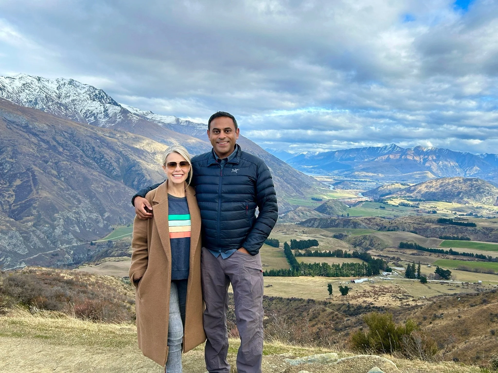 A couple having a photo taken on top of the Crown Range