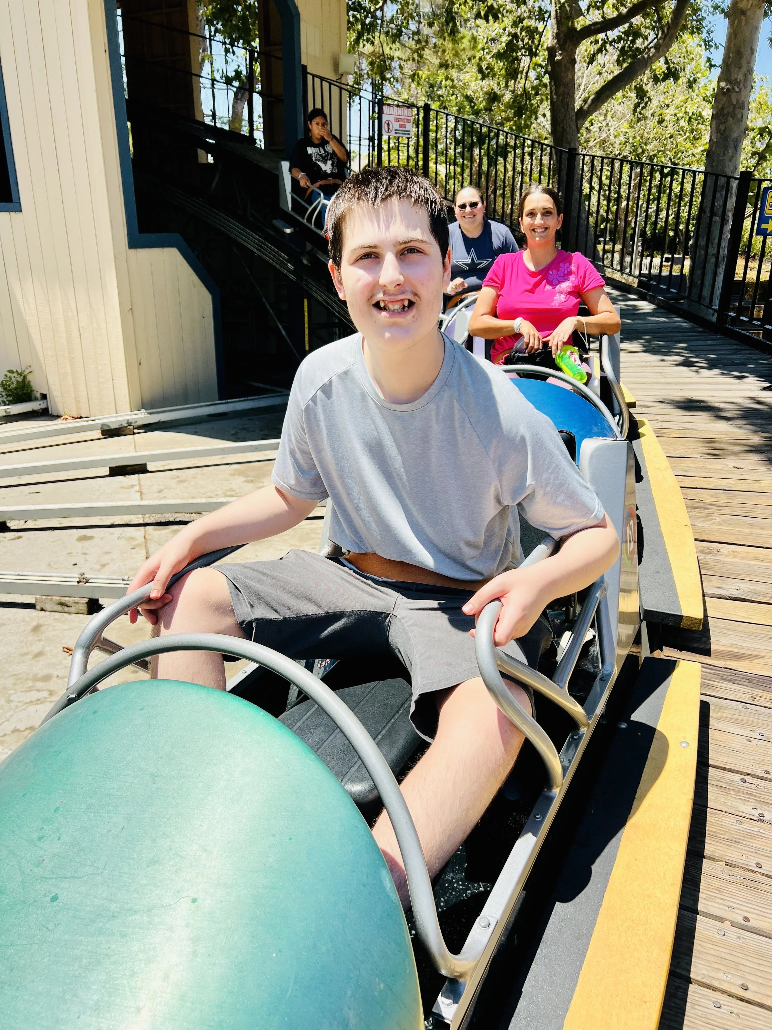 Micah on roller coaster.JPG