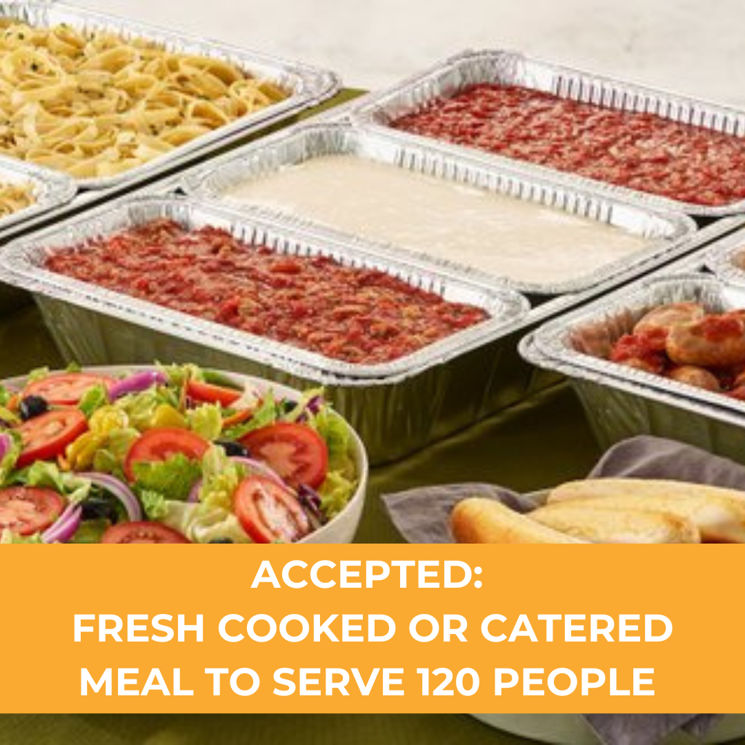Buffet table with salads, pasta, meat dishes, and baked goods.