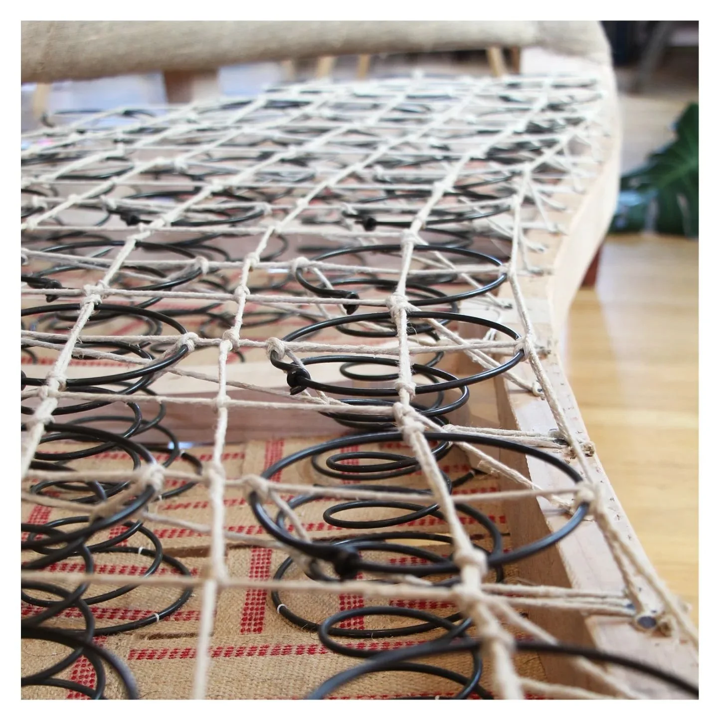Springing complete! 44 hand tied springs on this curved piece. 
.
.
.
.
.
.
#traditionalupholstery #handtiedsprings #craftsmanship #upholsterynyc