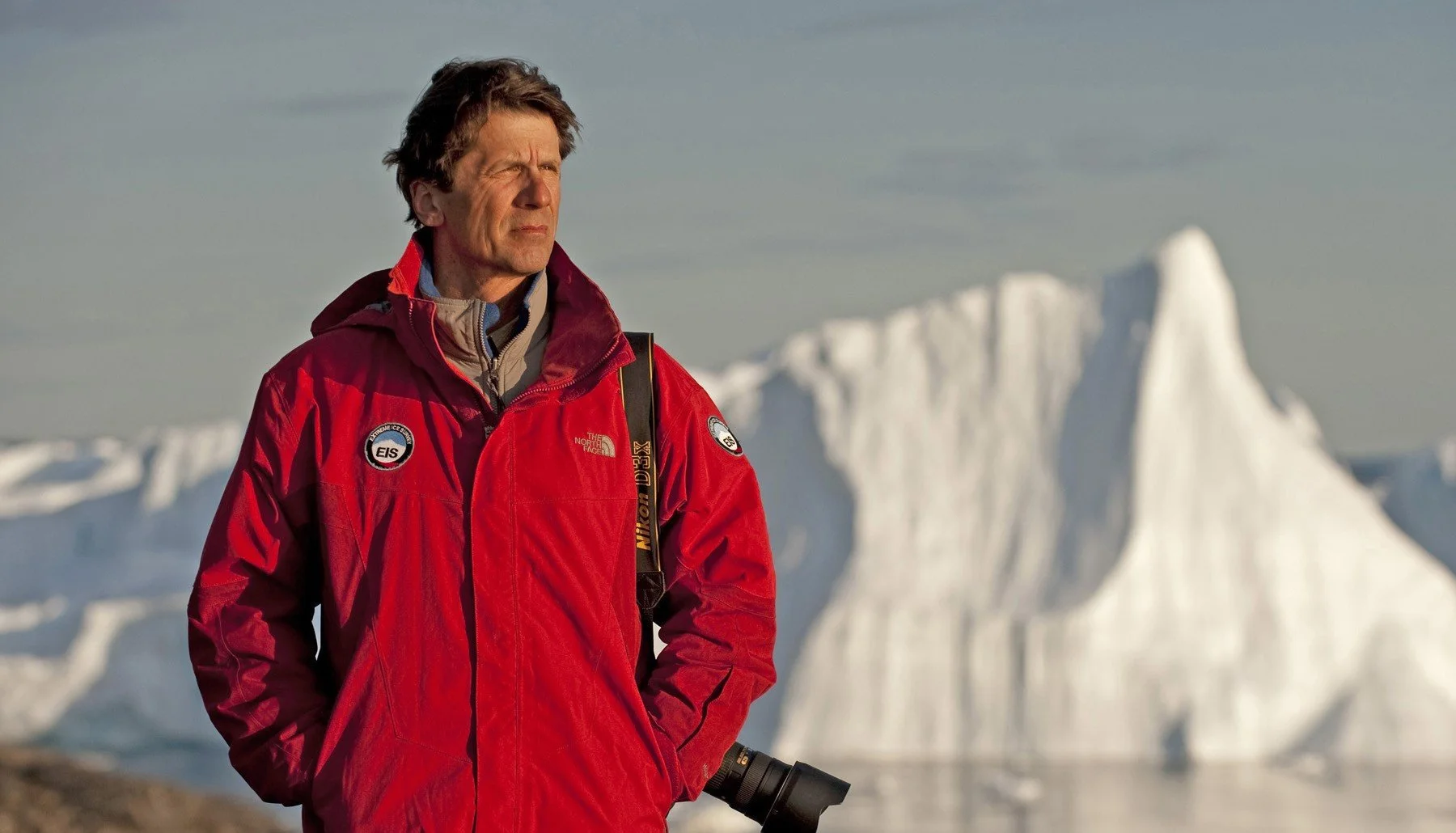 James Balog, environmental photographer, with Arctic icebergs in the background.