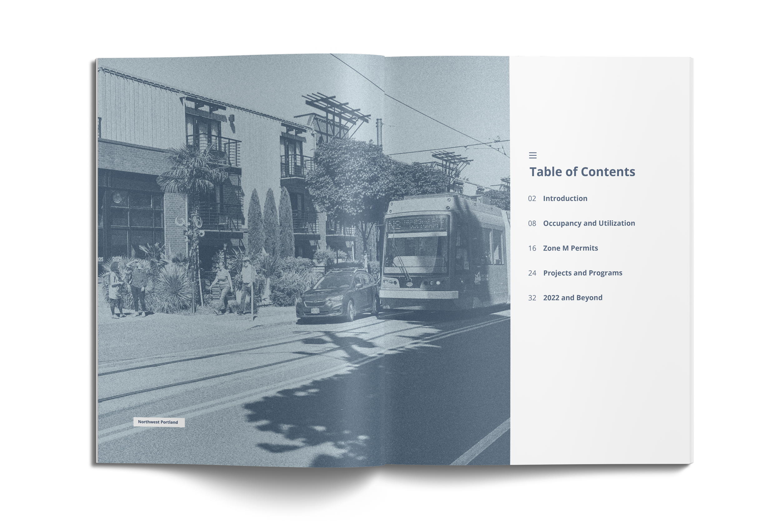 Annual report pages showing photo with car and streetcar.