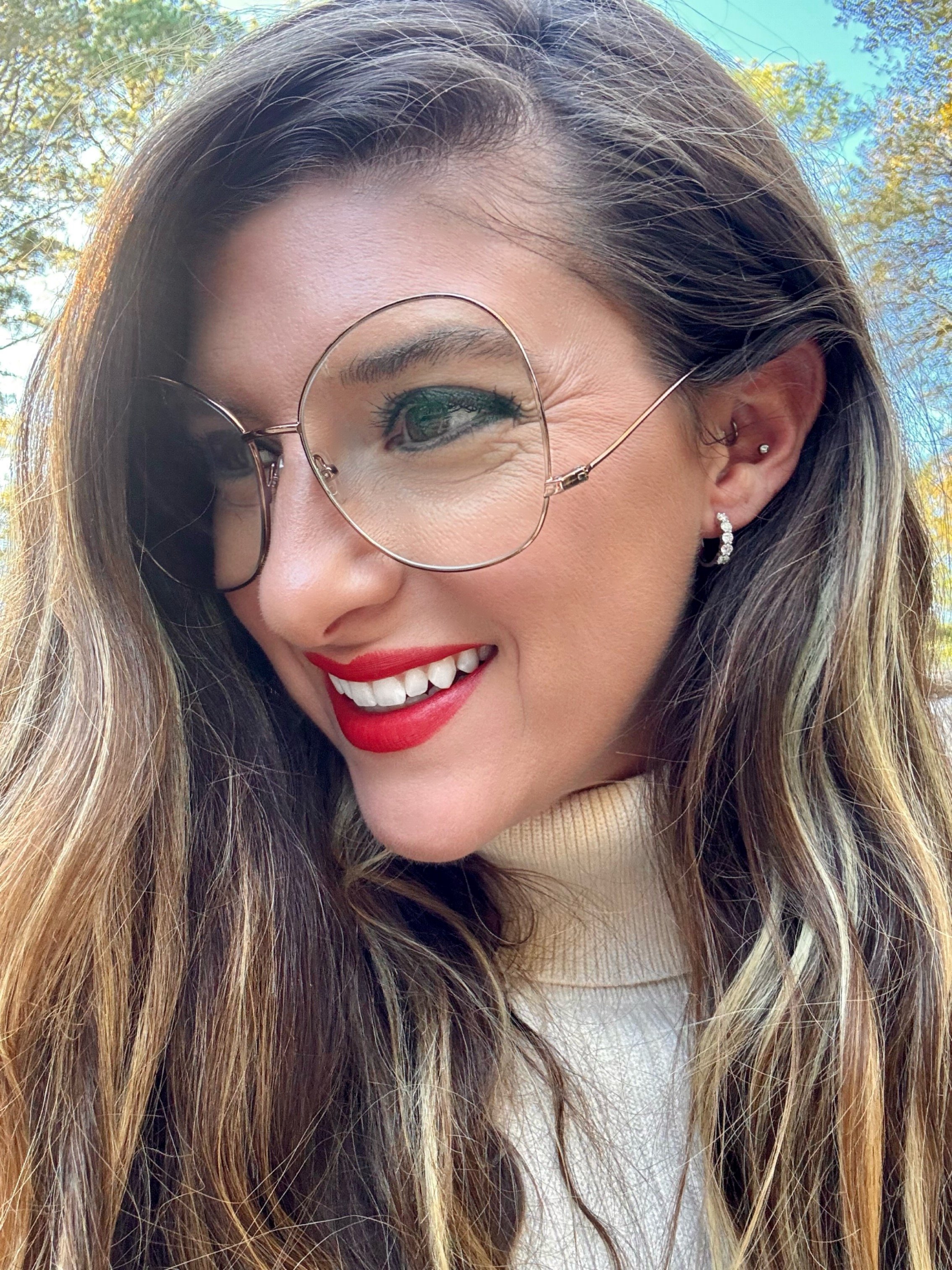 Mallory Richardson, creator of Mom of War Hear My Roar, smiling outdoors