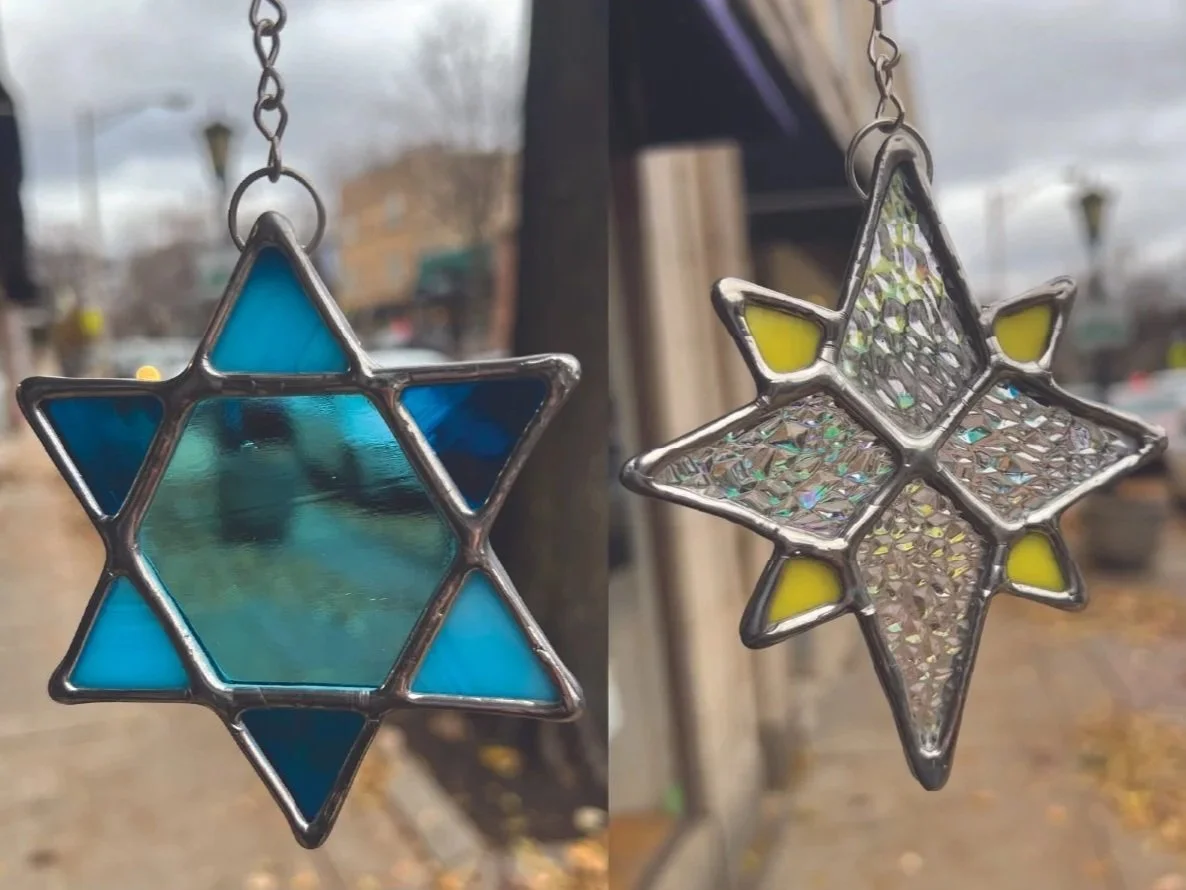 stained glass sun catchers and stained glass ornament of a jewish star and a north star both made during a glass in a flash stained glass workshop at stern glass works. these are showing diy art glass projects you can make at sgw in Oak Park IL 