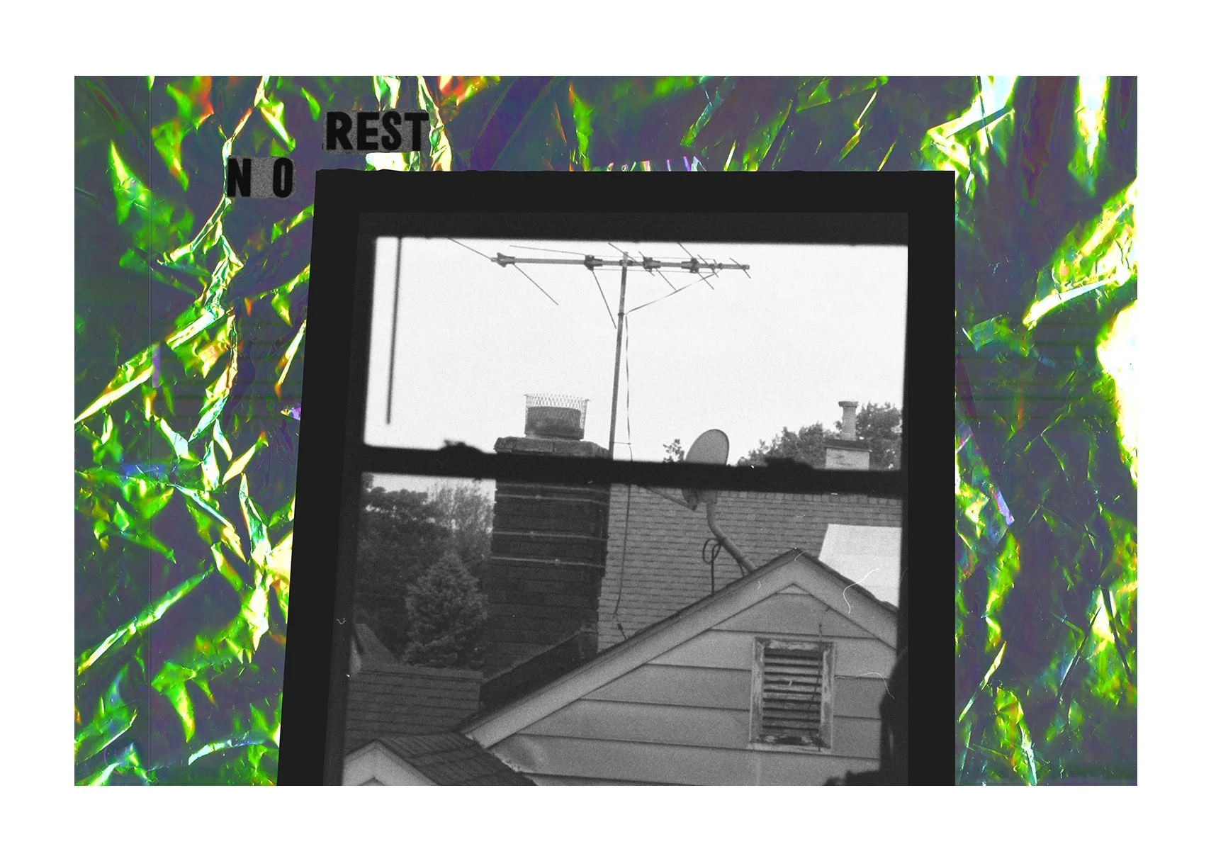 A black-and-white view through a window shows a neighboring roof, chimney, and trees, framed by iridescent cellophane collage and the words “NO REST.”