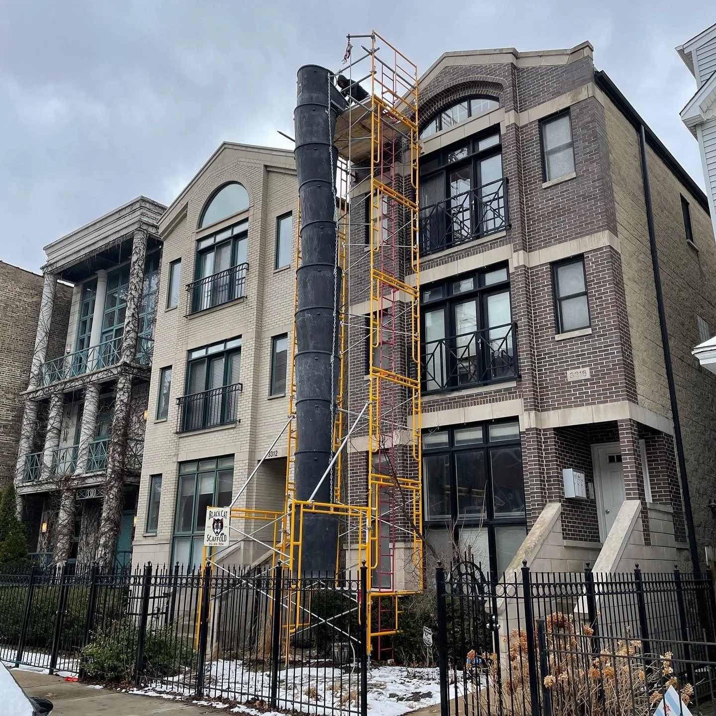 Garbage chute for roofers to safely dispose of shingles. - Black Cat Scaffold