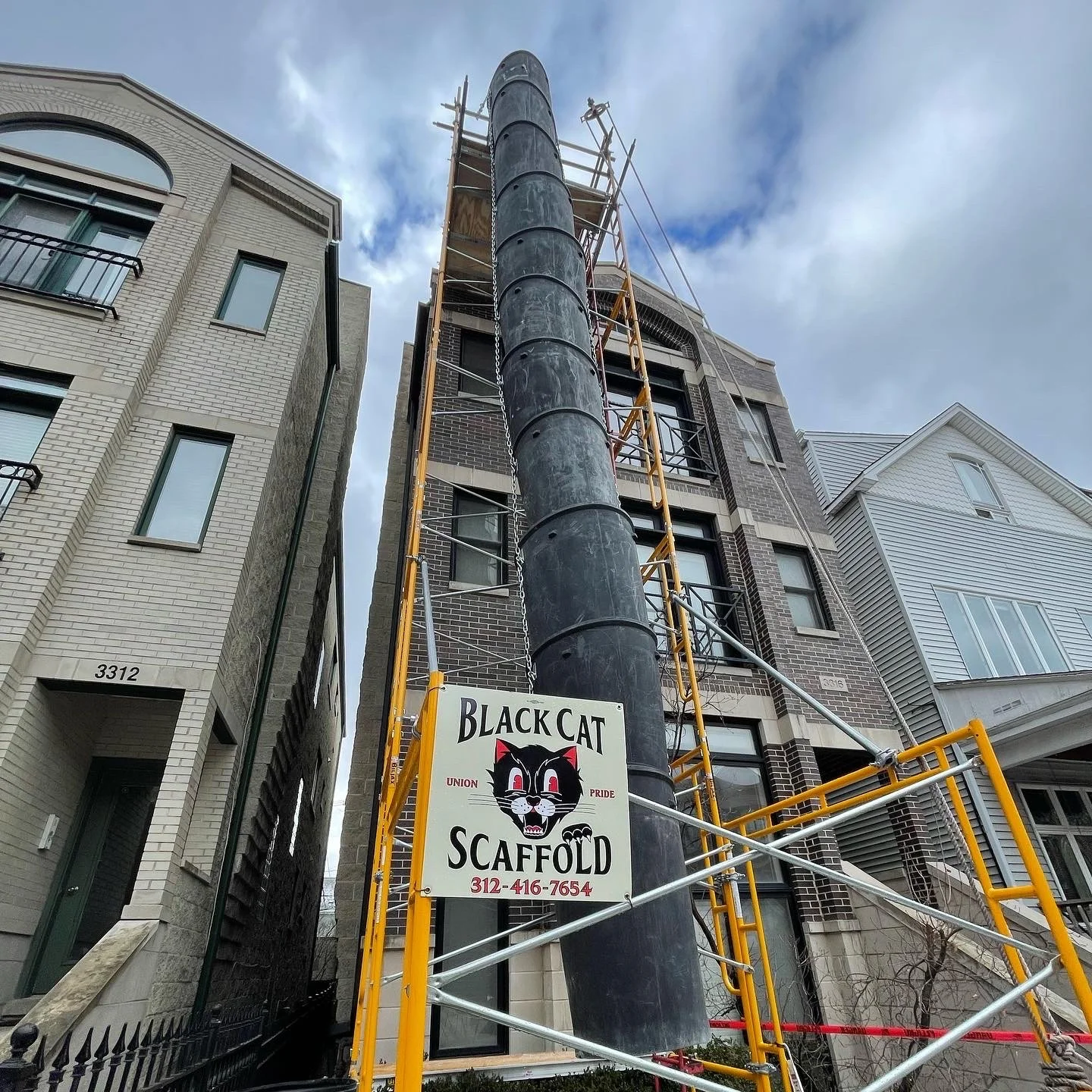 Garbage chute for roofers to safely dispose of shingles. - Black Cat Scaffold