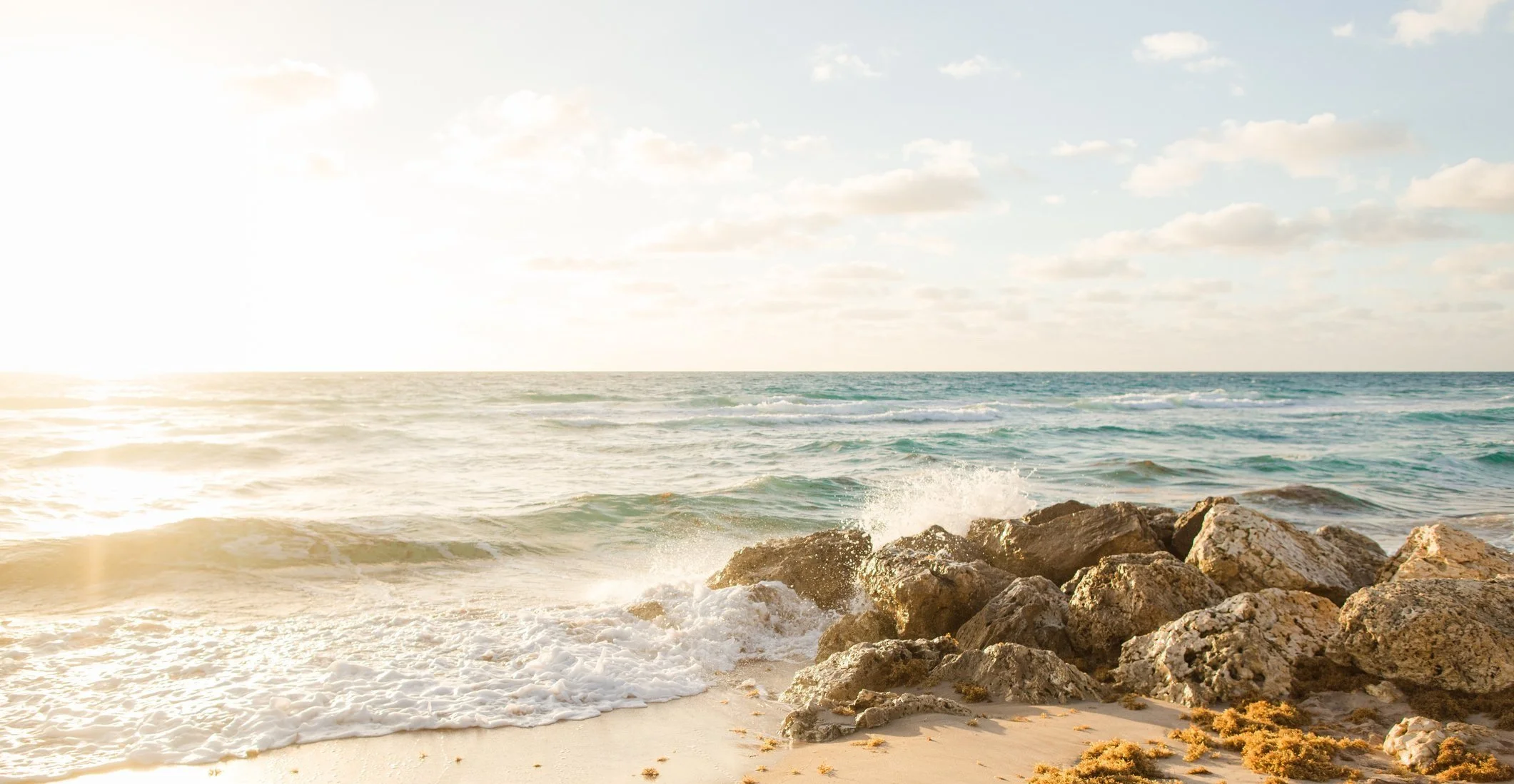 Lake Michigan waves gently crashing against large rocks