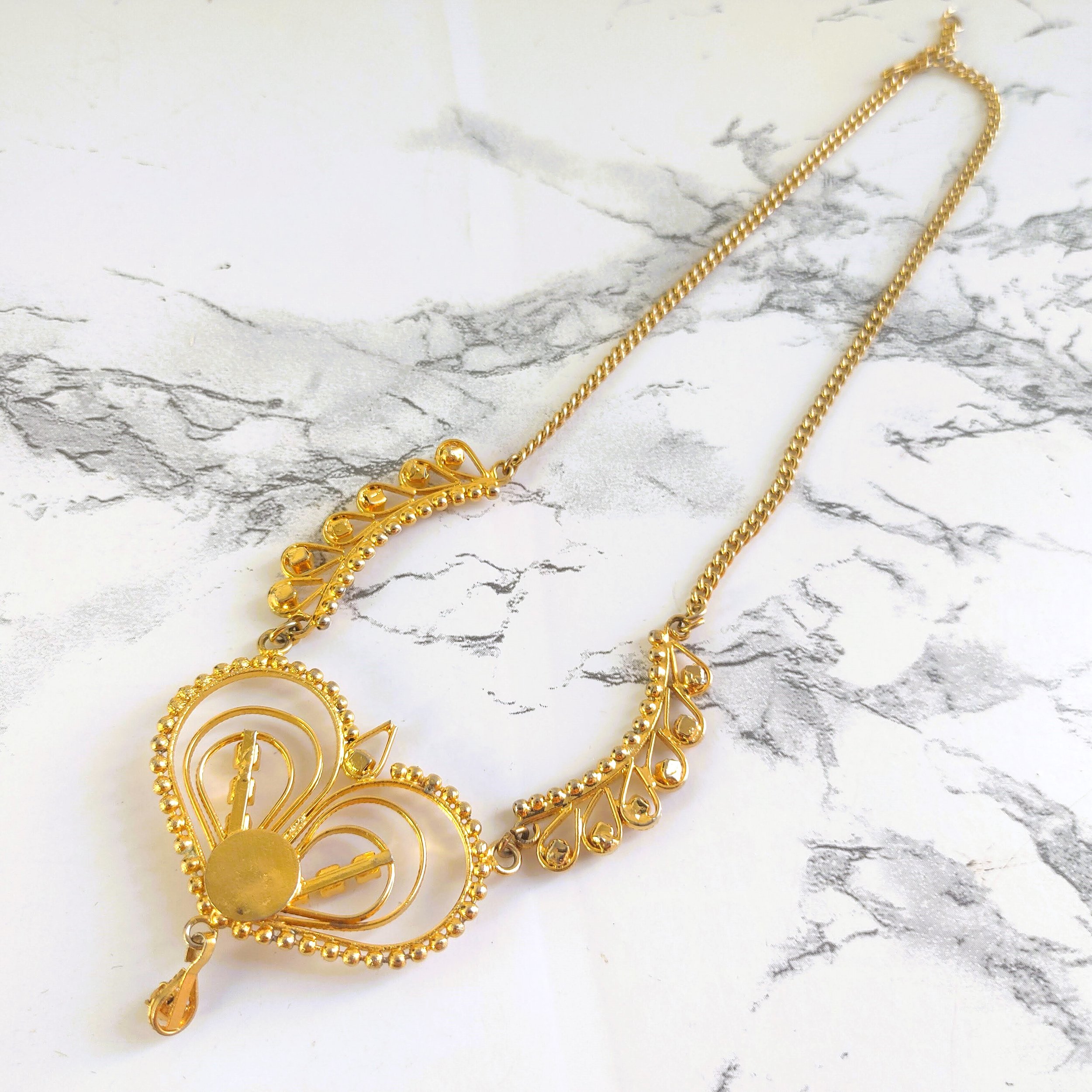 Vintage Gold-Tone Filigree Heart Necklace with Clear and Red Rhinestones