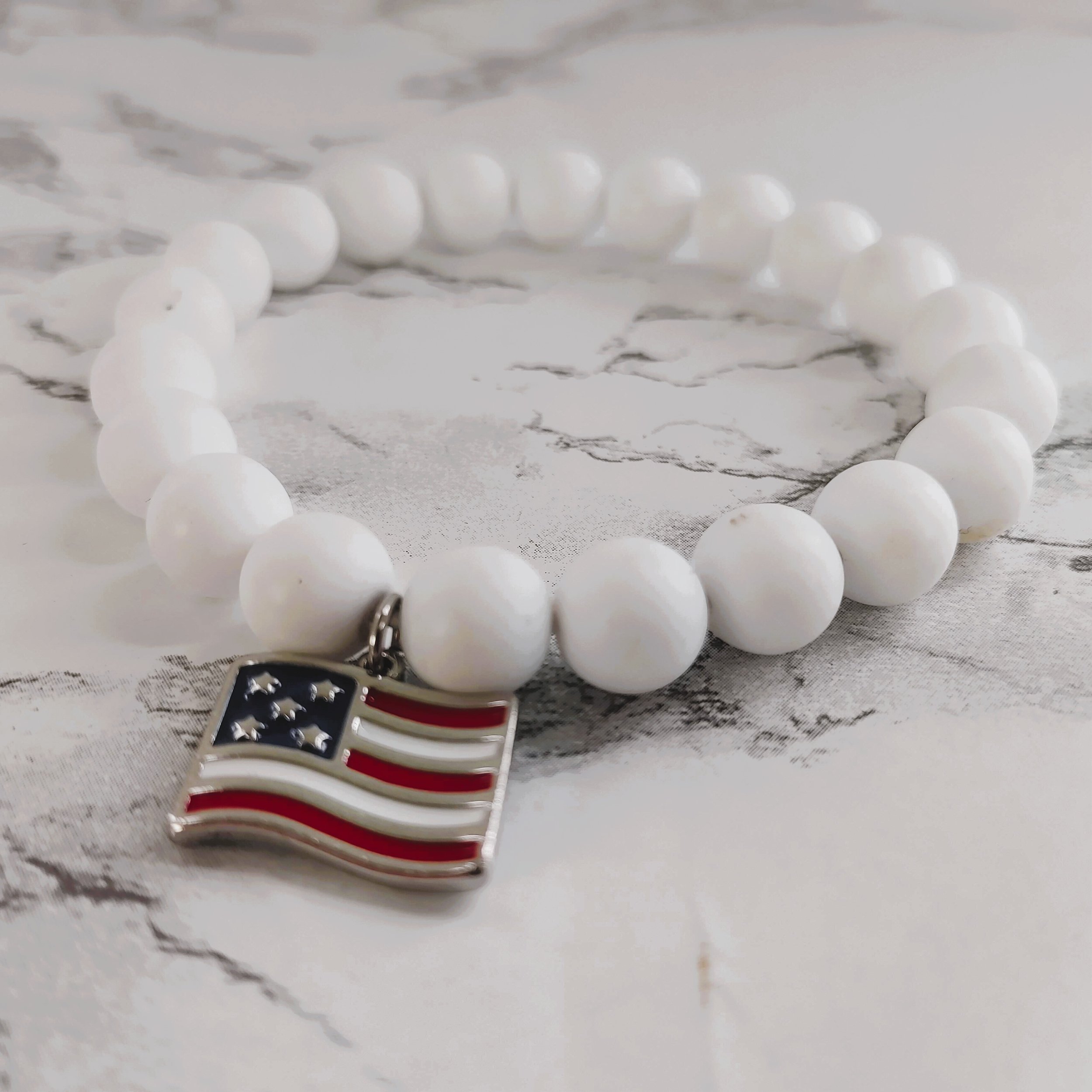 American Flag Beaded Bracelet - Stretch White Beads with Patriotic Charm