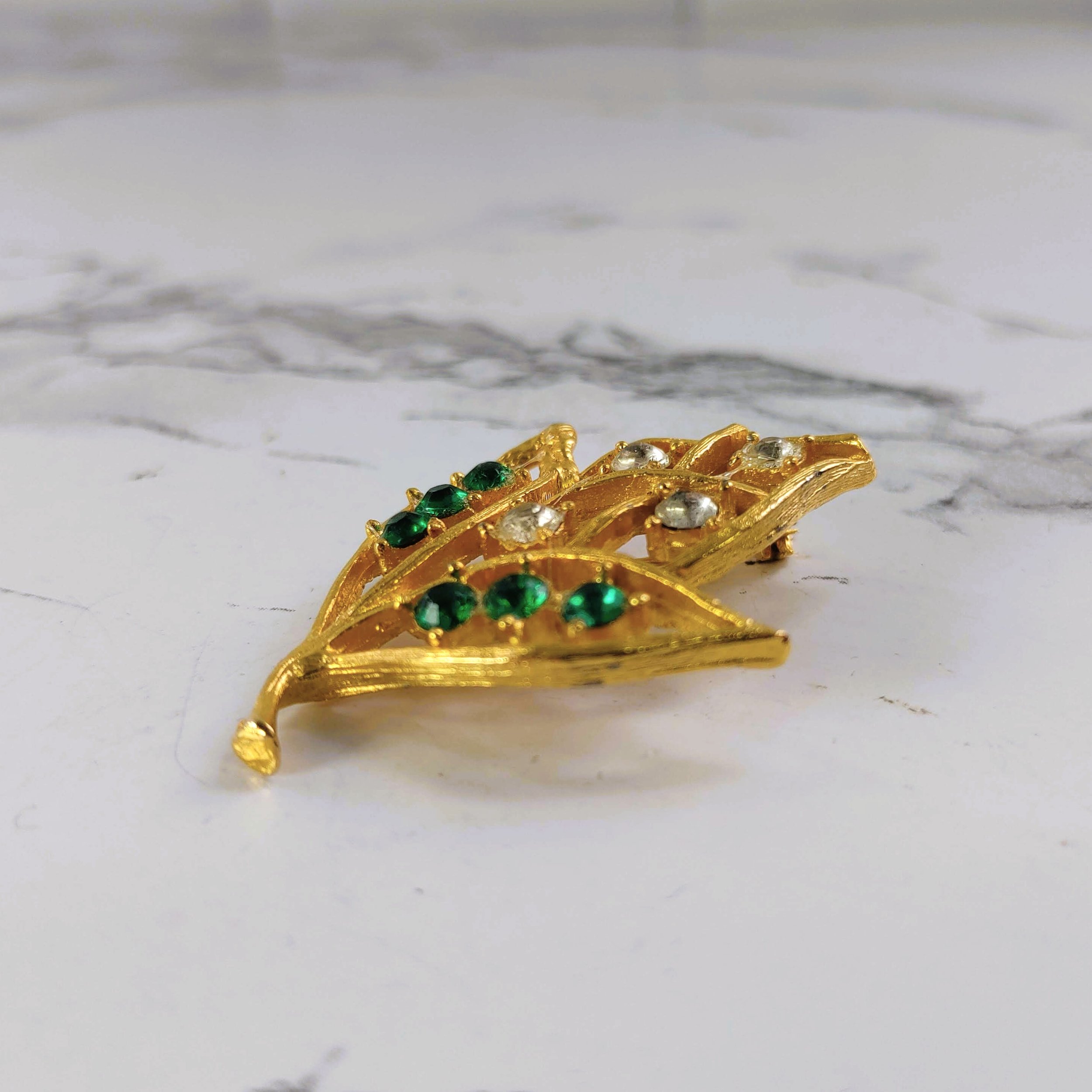 Vintage Gold-Tone Leaf Brooch with Clear and Green Rhinestones