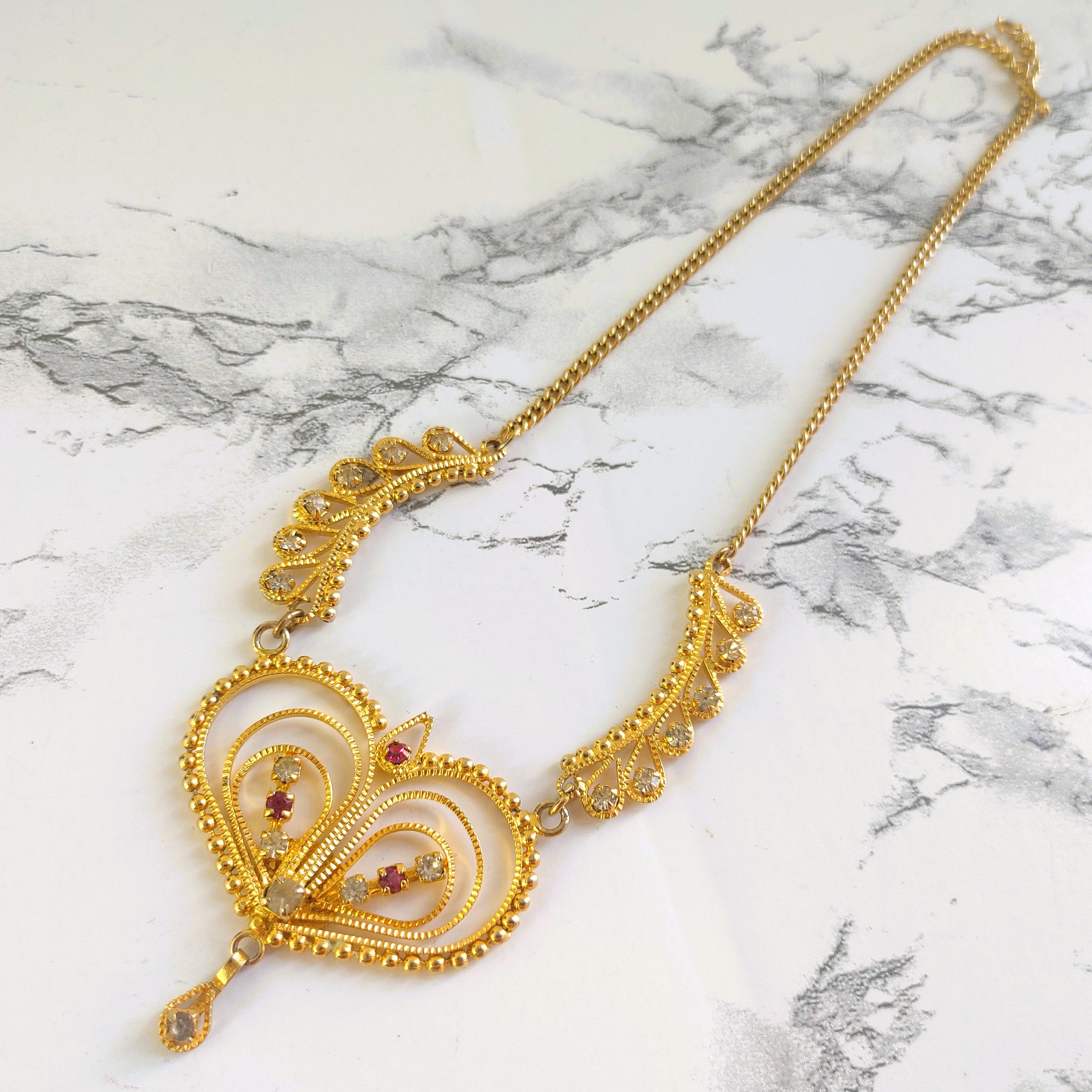 Vintage Gold-Tone Filigree Heart Necklace with Clear and Red Rhinestones