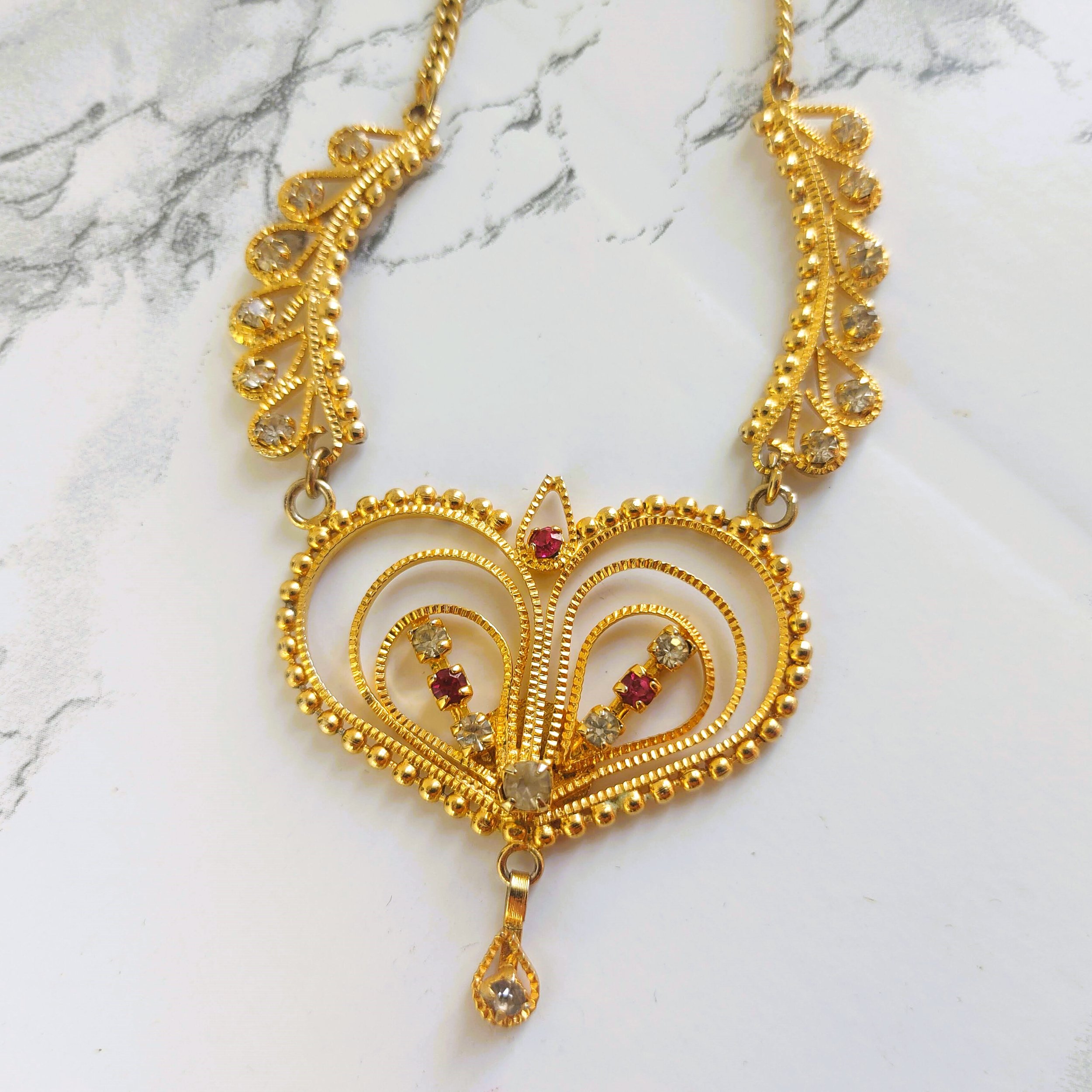 Vintage Gold-Tone Filigree Heart Necklace with Clear and Red Rhinestones