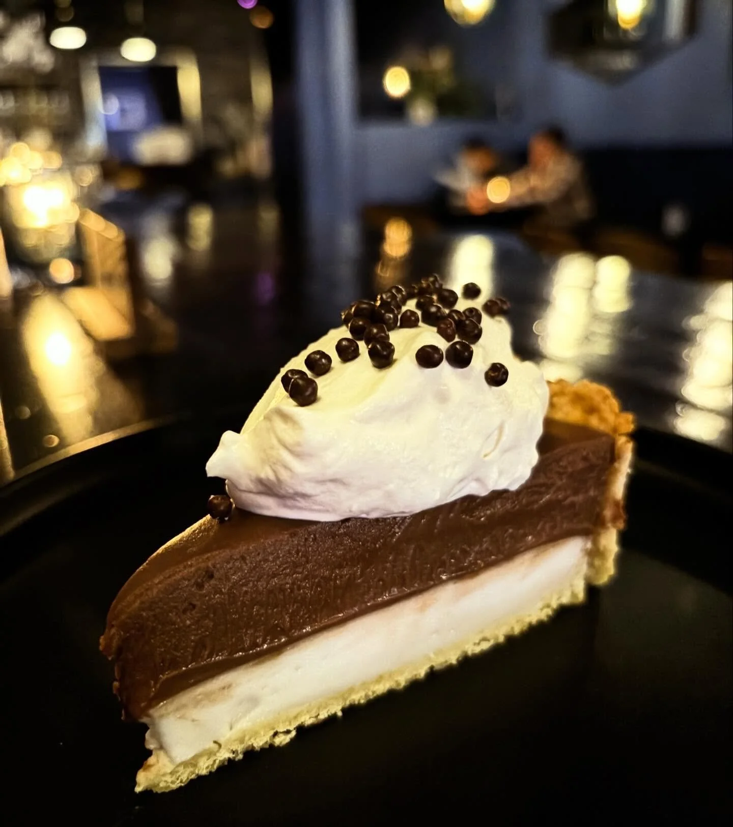 Introducing our "Not so Ted's" Chocolate Haupia Pie! 🥧🍫🥥

Our take on the classic North Shore favorite of Ted's Bakery: It features a flaky shortcrust pastry with layers of Haupia (coconut pudding), Chocolate Budino, fresh whipped cream,