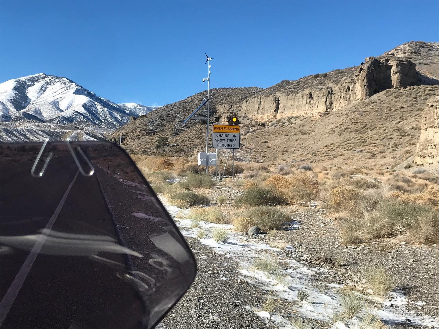 Yesterday on my way to Mount Charleston; had to turn back as at about 6000 feet road began to be covered with snow/ice, can be seen when zooming behind my 1200GS by the next bend... Snow tires and chains were required as read on the road sign with am