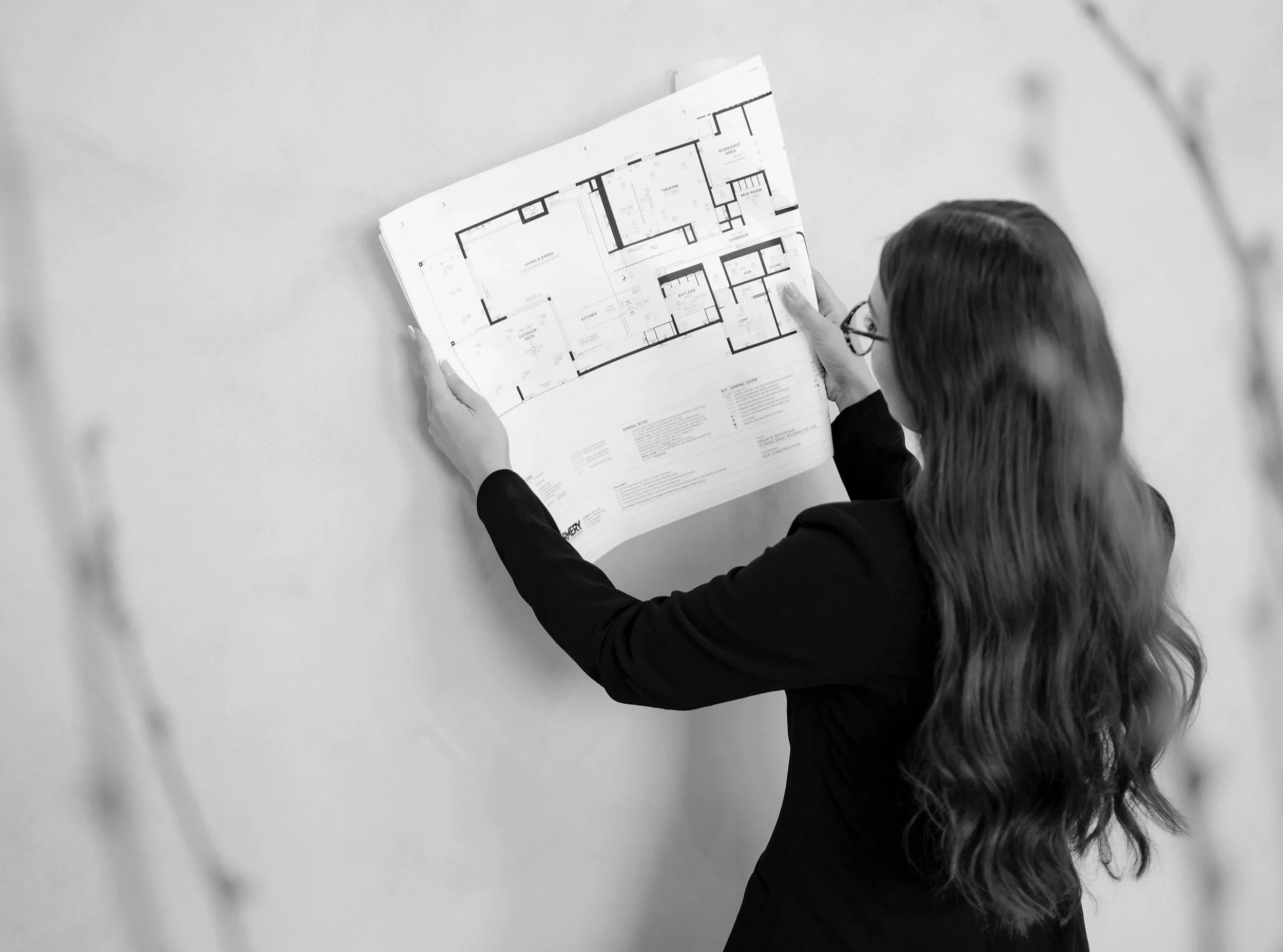 Architectural floor plans being reviewed and marked up during design development