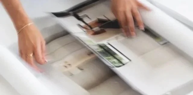 Architect using digital design software and AI tools on a laptop