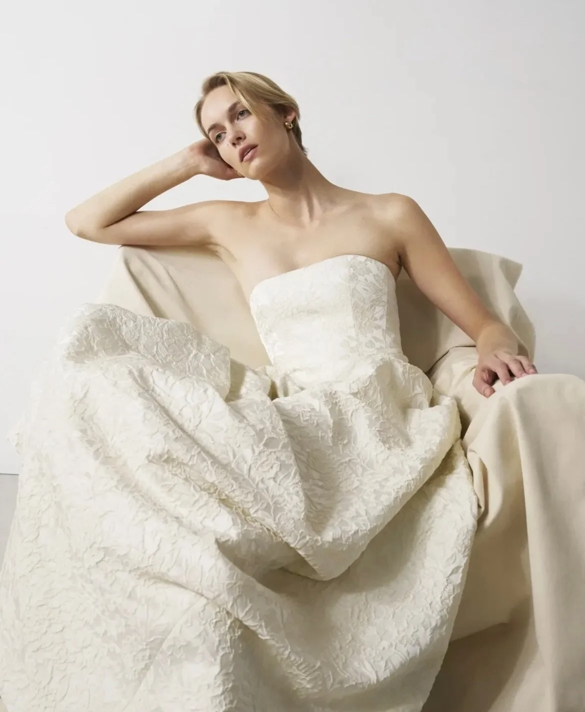 Bon Bride BB:87 contemporary drop waist made in a beautiful brocade textured fabric in cream.

Slide for plain silk mix.

Which do you prefer? 

Both styles available to try on. Bon Bride offers a short production time of only 4 months. Book now at t